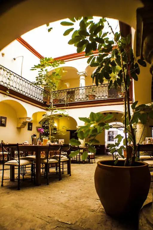 Leafy inner courtyard at Parador San Agustin